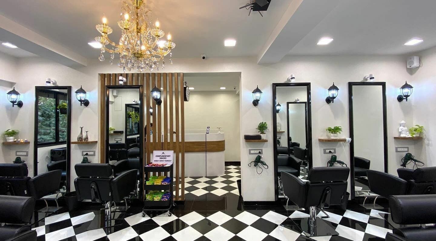Elegant interior of Hair Castle - Dombivali, Dombivli, Maharashtra, IN, featuring stylish chairs and chic lighting.