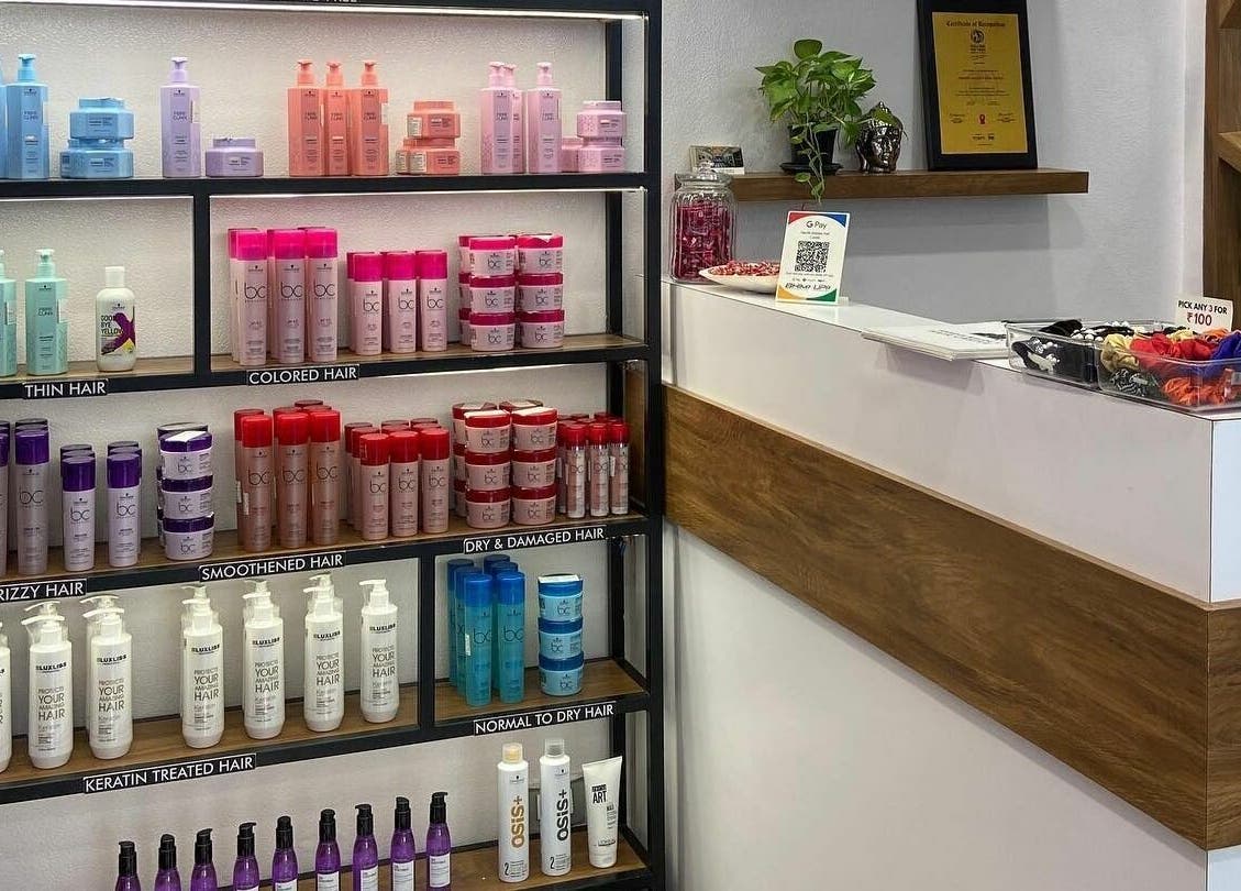 Shelves of hair care products at Hair Castle - Dombivali, offering diverse treatments. Location: Dombivli, Maharashtra, IN.