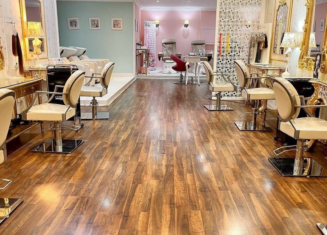 Inside Pout Salon and Spa, Dubai, AE: luxurious styling chairs, elegant decor with warm lighting.