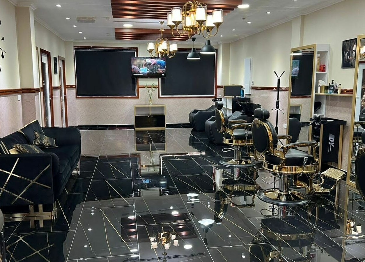 Luxurious interior of The Sharp Edge Gents Salon in Dubai, Dubai, AE with stylish chairs and decor.
