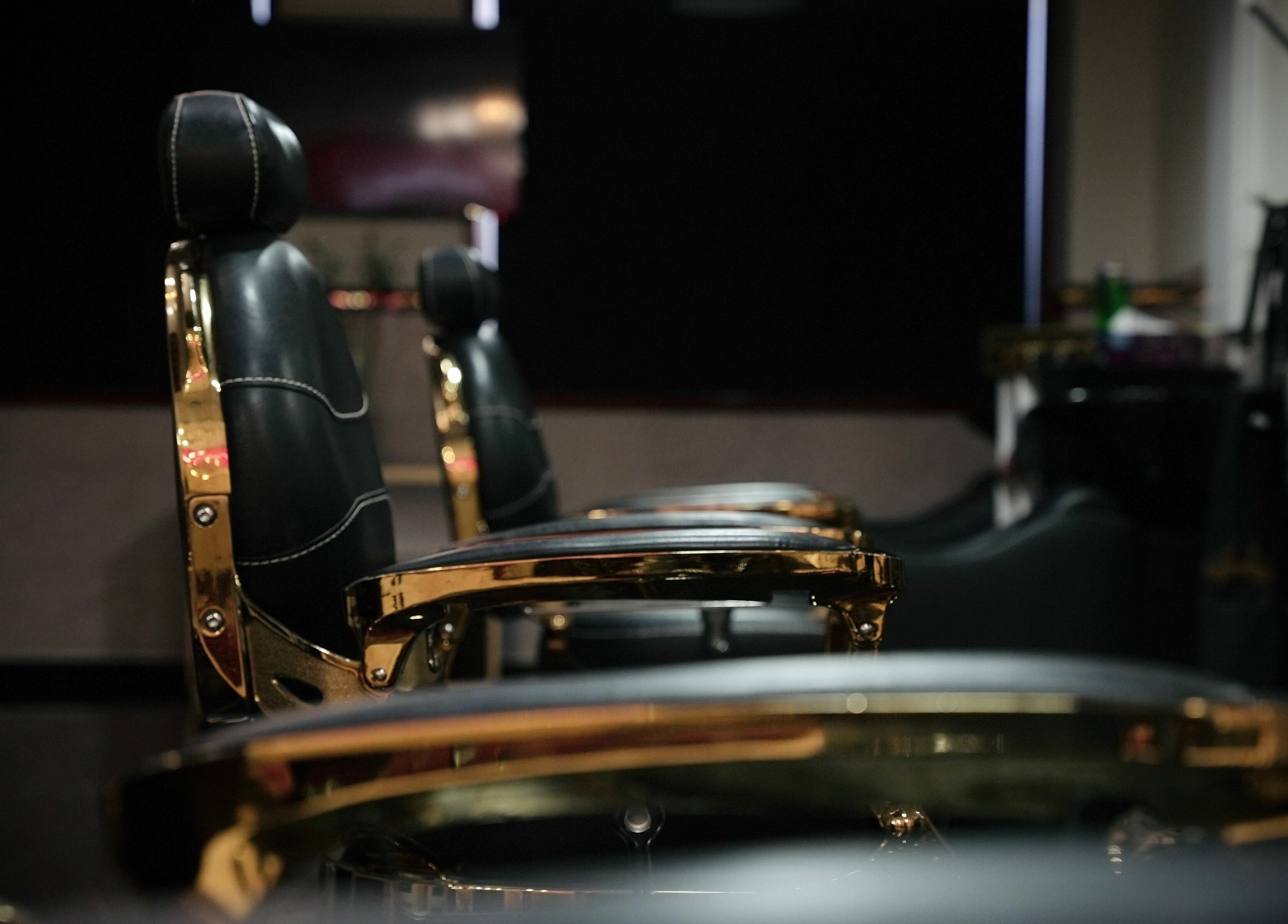 Luxurious barber chairs at The Sharp Edge Gents Salon, Dubai, AE, showcasing elegance and comfort.