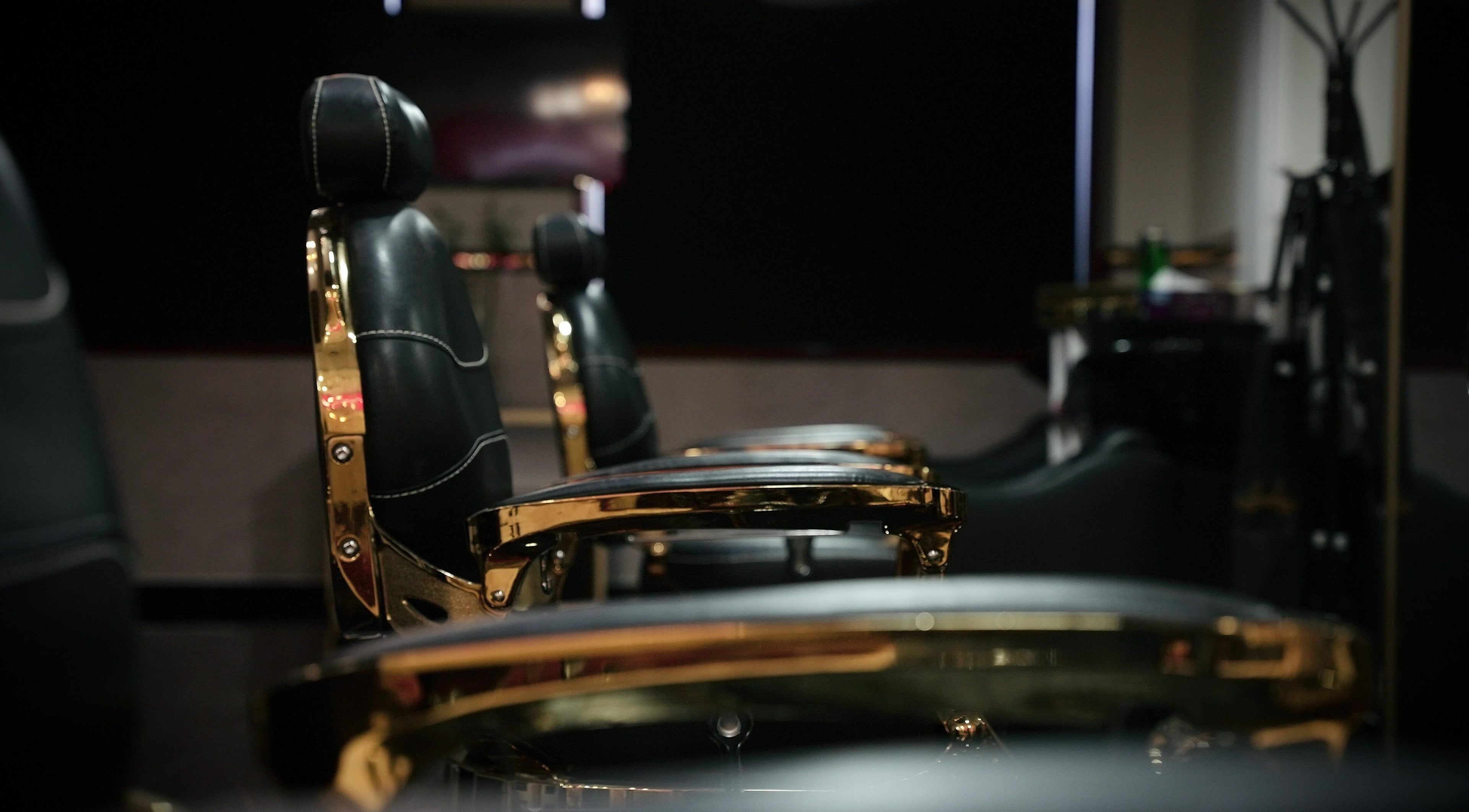 Luxurious barber chairs at The Sharp Edge Gents Salon, Dubai, AE, showcasing elegance and comfort.