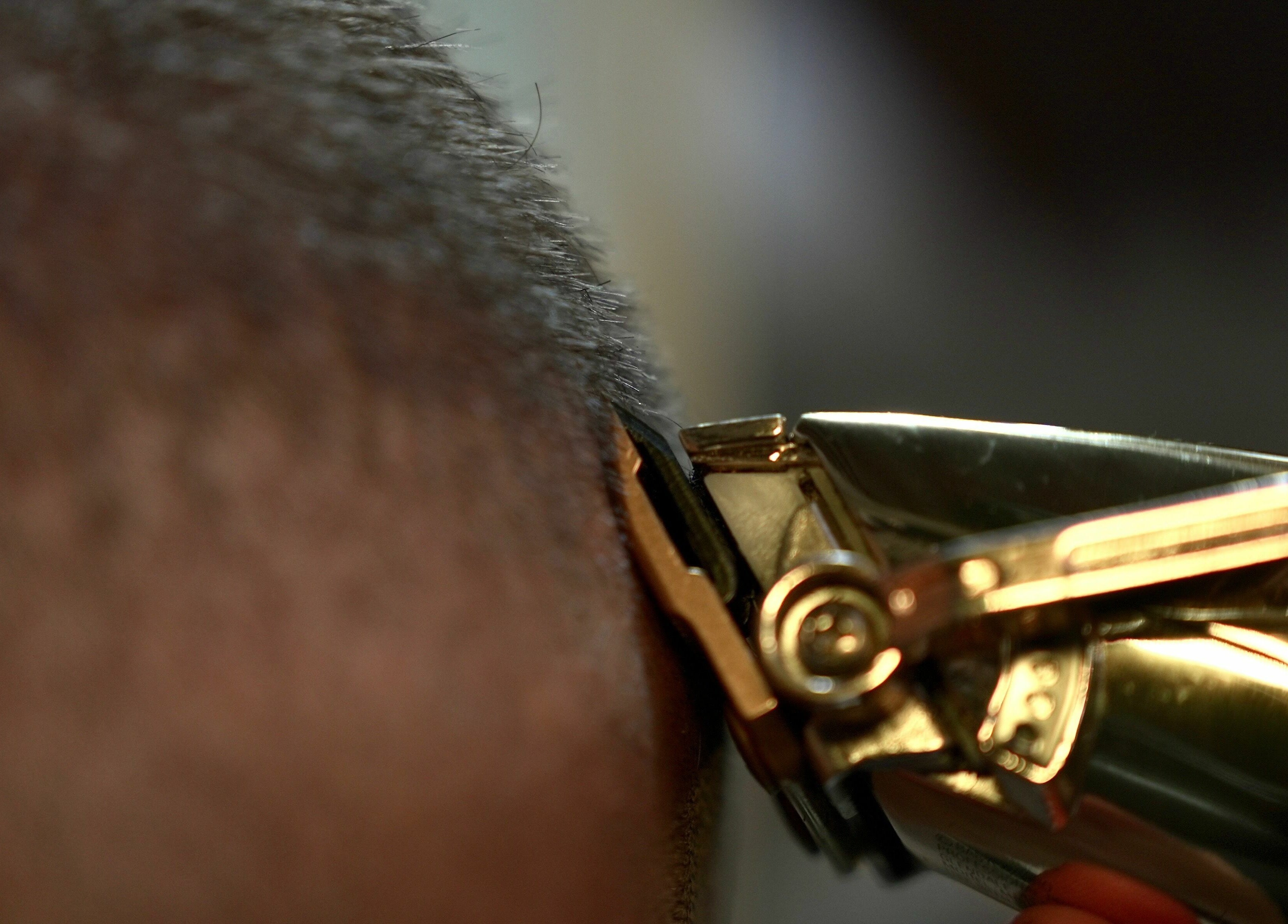 Close-up of hair clipper in use at The Sharp Edge Gents Salon, Dubai, Dubai, AE, showcasing expert grooming.