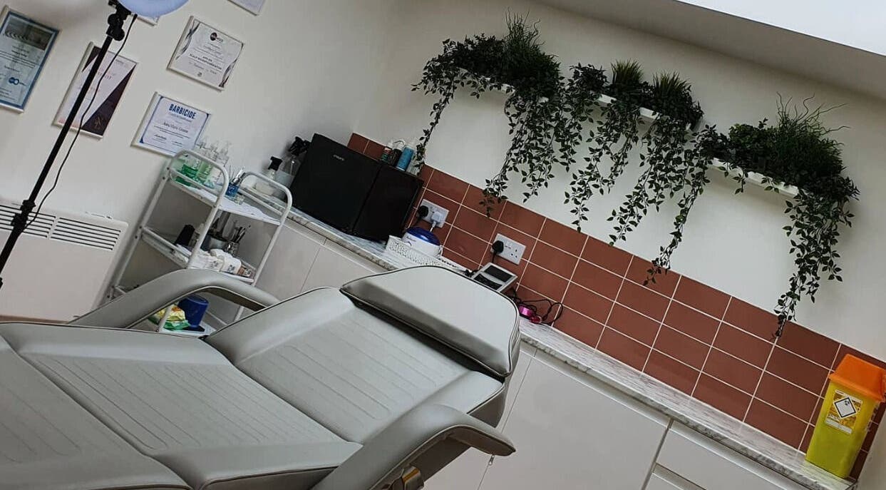 Modern treatment room at AnneMarie Beauty Enhanced, Johnston, Wales, GB with comfortable chair and serene decor.