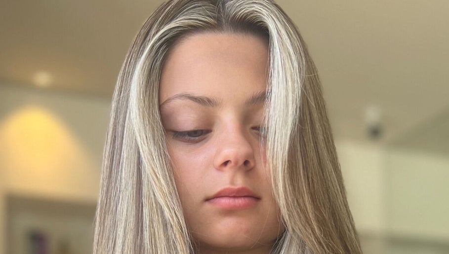 Stylish blonde hair at Valori Hair salon in Melbourne, Victoria, AU, showcasing sleek highlights.