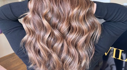 Lustrous wavy hair styled at Valori Hair, Melbourne, Victoria, AU, showcasing expert color and texture.