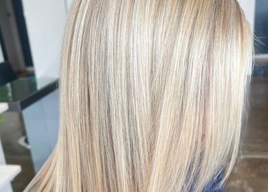 Close-up of sleek blonde hair at Valori Hair, Melbourne, Victoria, AU, highlighting professional styling.