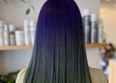 Vibrant purple-to-green hair at Valori Hair, Melbourne, Victoria, AU, showcasing expert color blending.