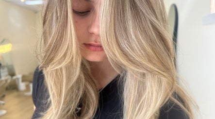 Close-up of sleek blonde hair at Valori Hair, Melbourne, Victoria, AU, showcasing expert styling.
