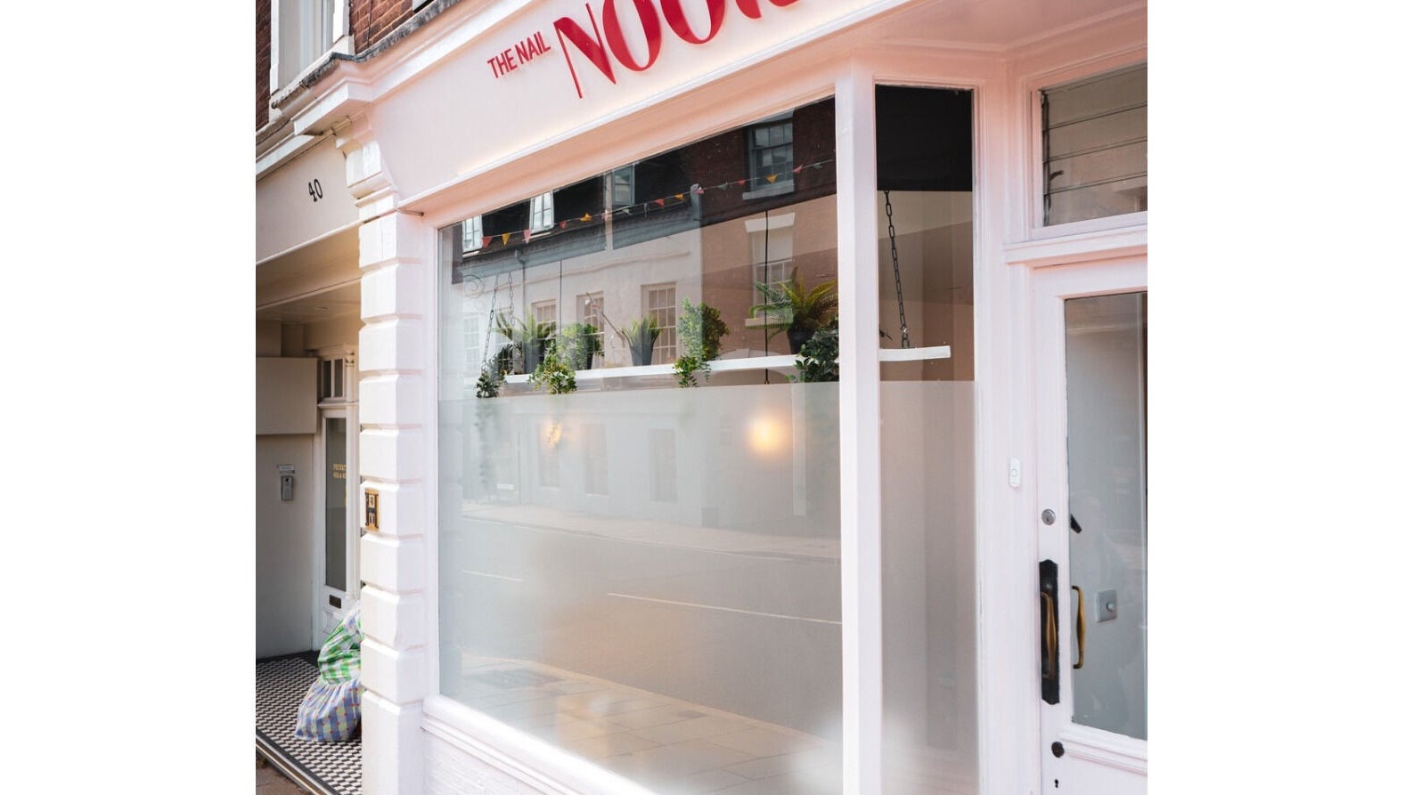 Storefront of Maisy Does Manis in Shrewsbury, England, GB, featuring elegant window displays.