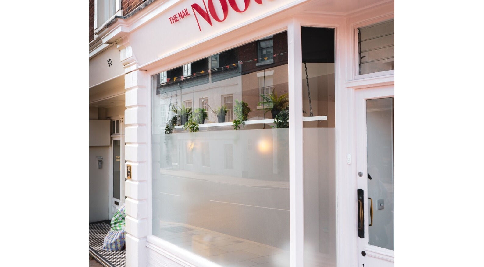 Storefront of Maisy Does Manis in Shrewsbury, England, GB, featuring elegant window displays.