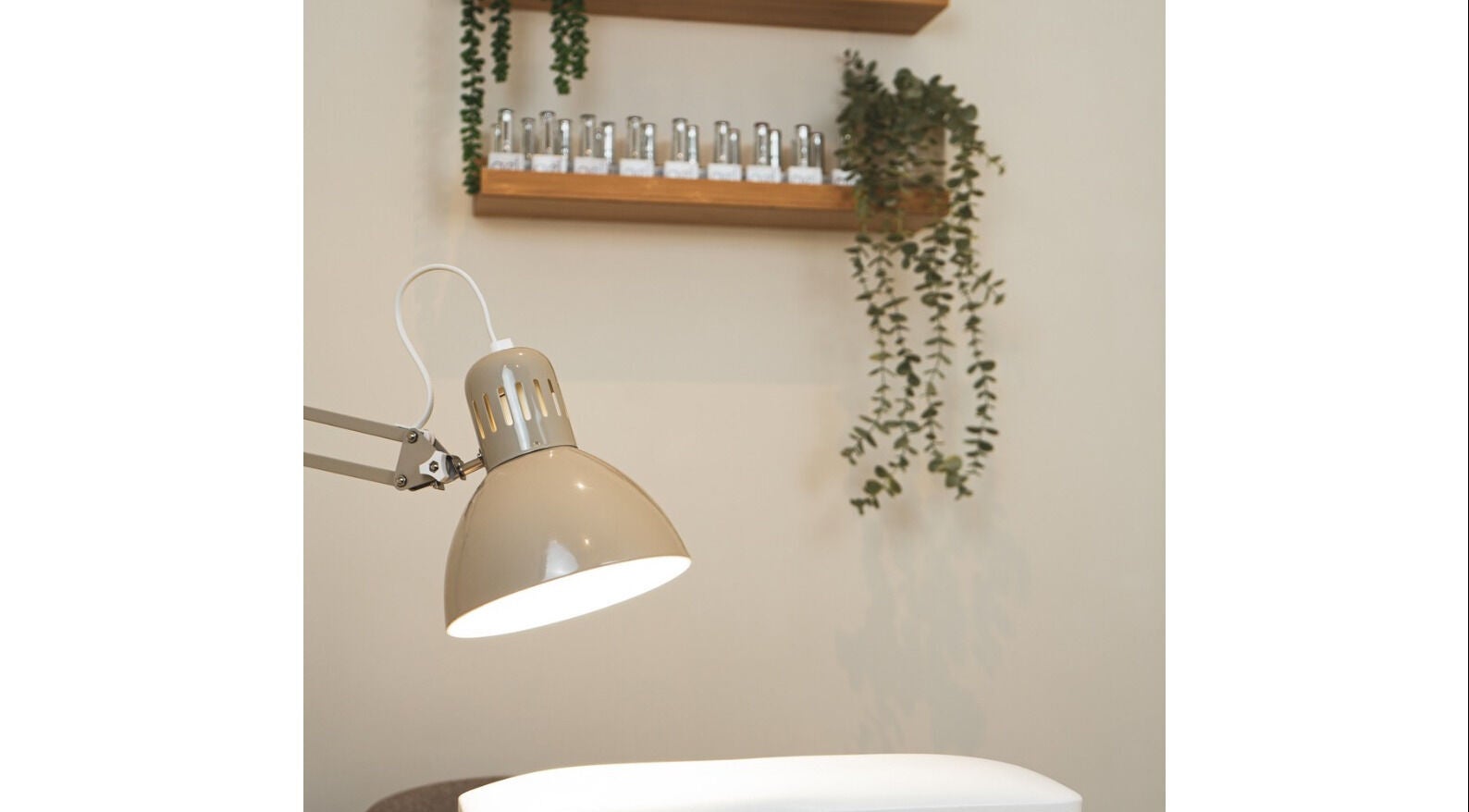 Relaxing setup at Maisy Does Manis with lamp and greenery in Shrewsbury, England, GB.