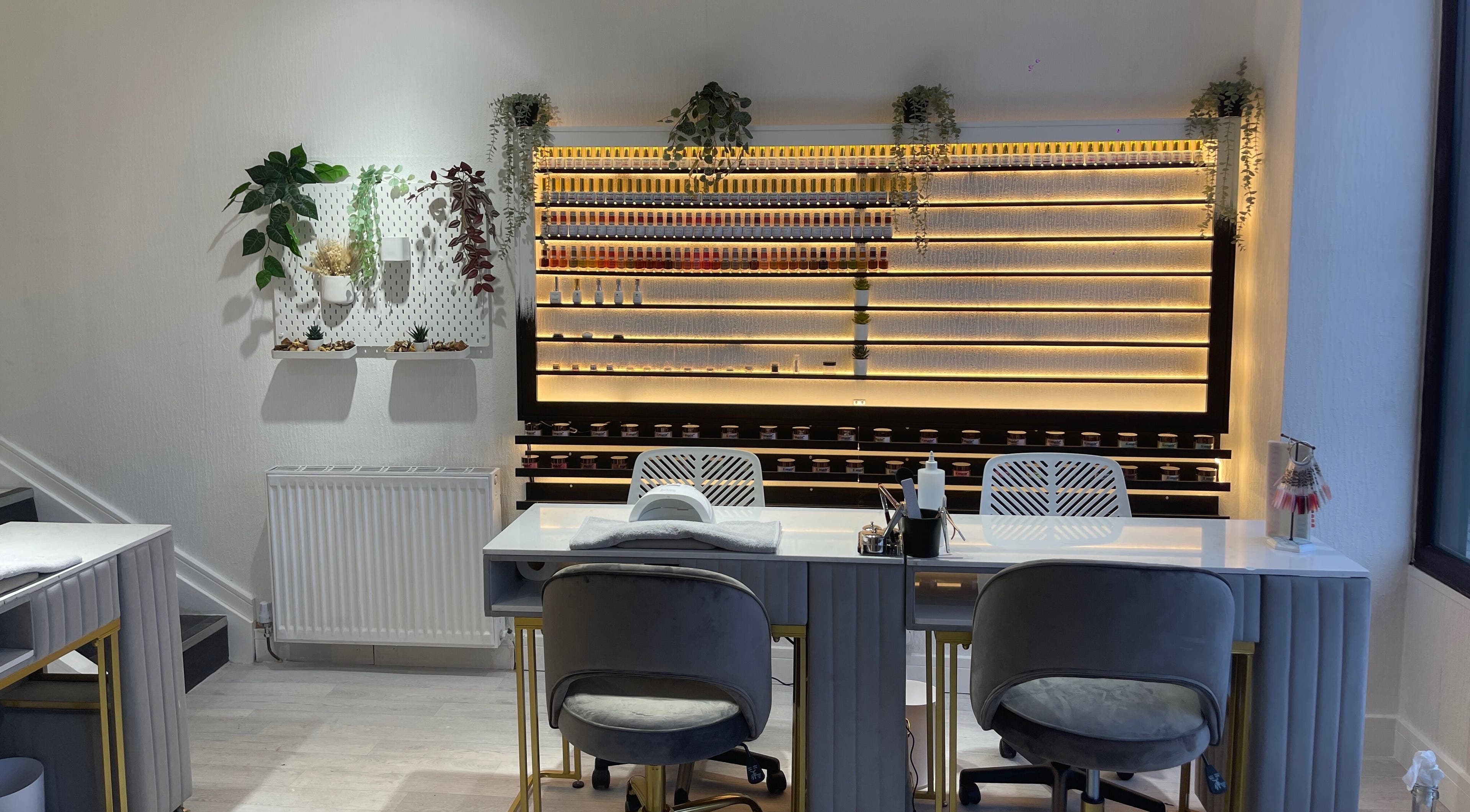 Sleek interior of Radcliffe Nails and Spa in Radcliffe, England, GB with nail polish display and seating.