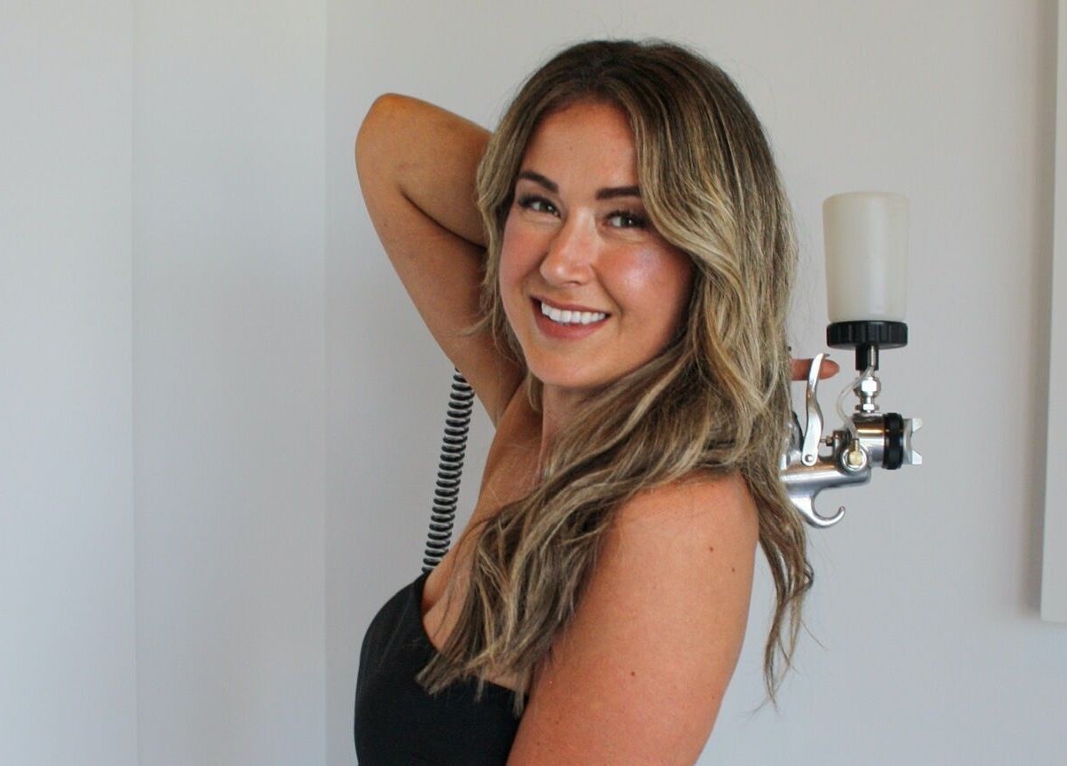 Airbrush tanning session at Afterglow Airbrush Studio, Nanaimo, British Columbia, CA with skilled technician.