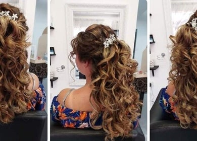 Gorgeous curled hairstyle at Carla Wernars Hairdressing in Alberton, Gauteng, ZA showcasing intricate floral accessory.