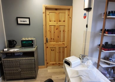 Calm treatment room at Jenny's Beauty Boudoir, Galway, County Galway, IE with nail polish display.