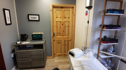 Calm treatment room at Jenny's Beauty Boudoir, Galway, County Galway, IE with nail polish display.