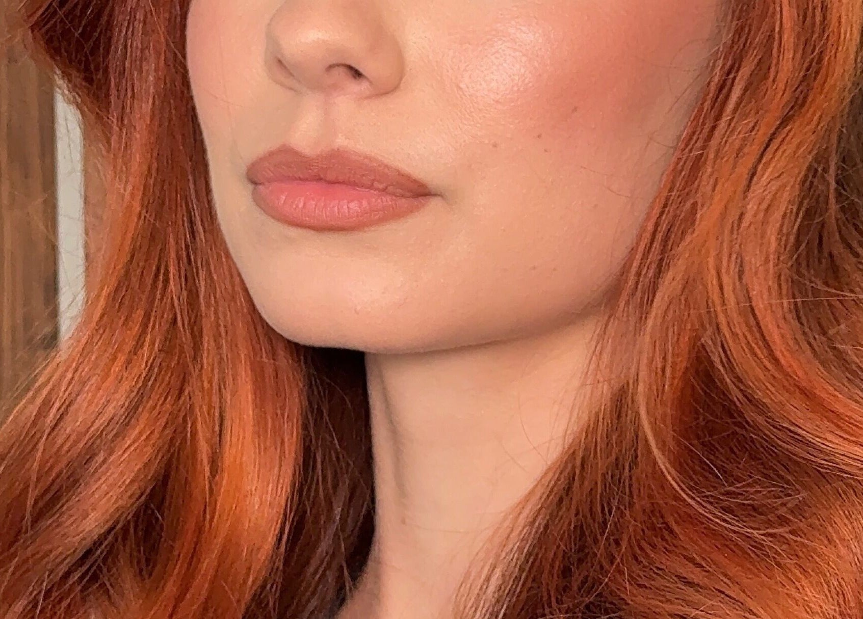 Close-up of a woman with radiant ginger hair by Faces By Jana, Melbourne, Victoria, AU.