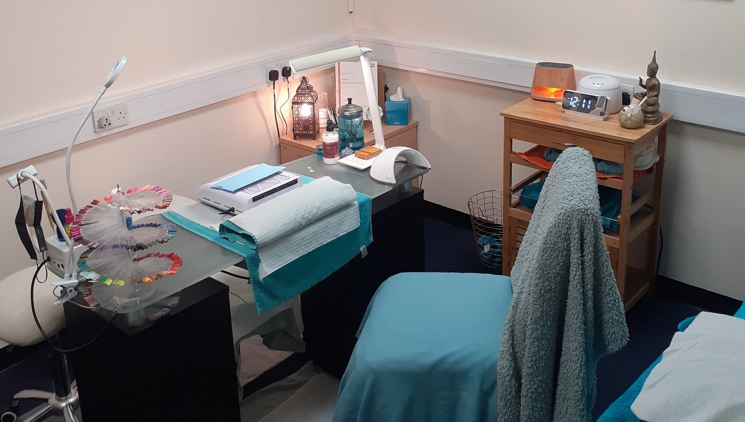 Elegant treatment room at The Nook, Ellesmere Port, England, GB, with soothing decor and beauty equipment.