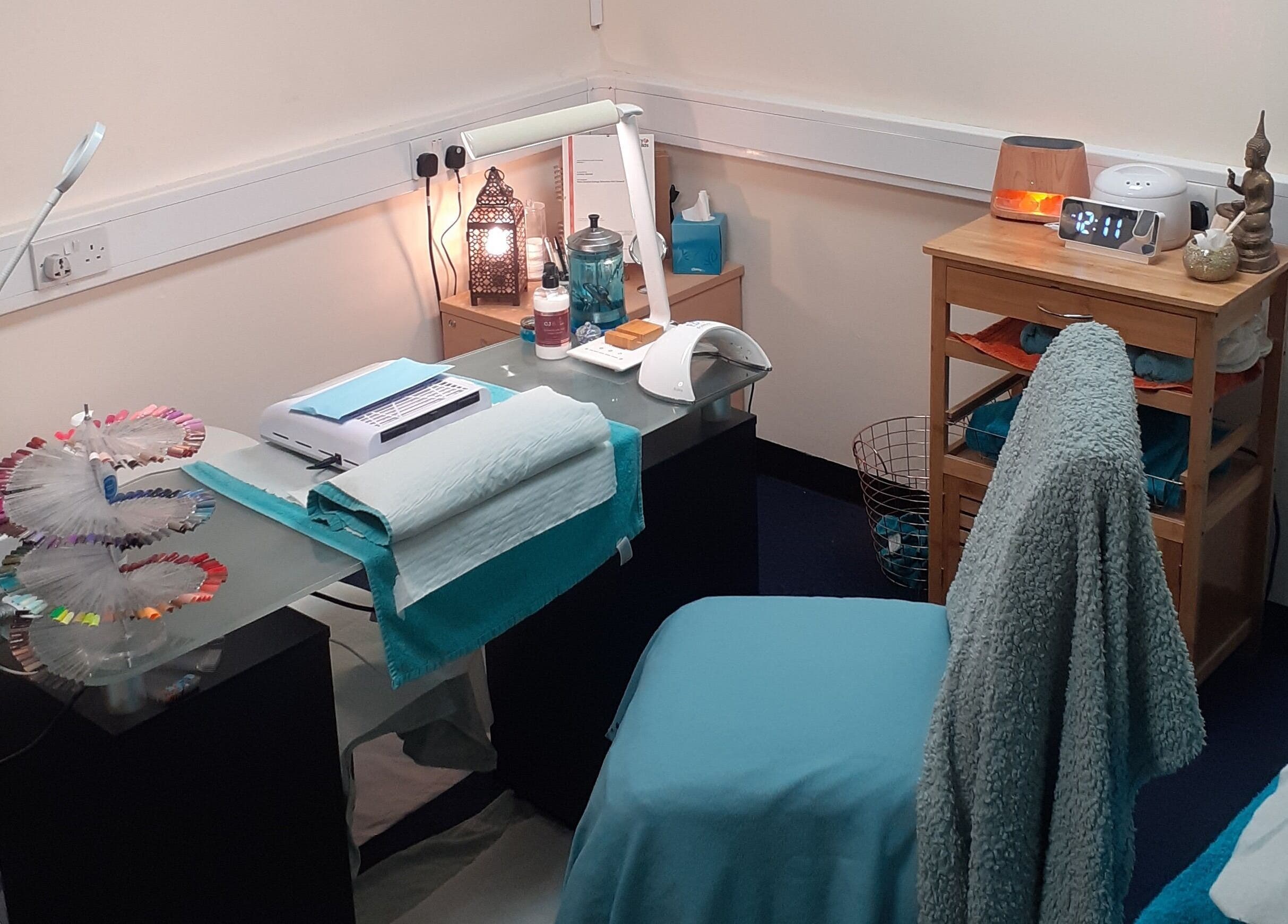 Elegant treatment room at The Nook, Ellesmere Port, England, GB, with soothing decor and beauty equipment.
