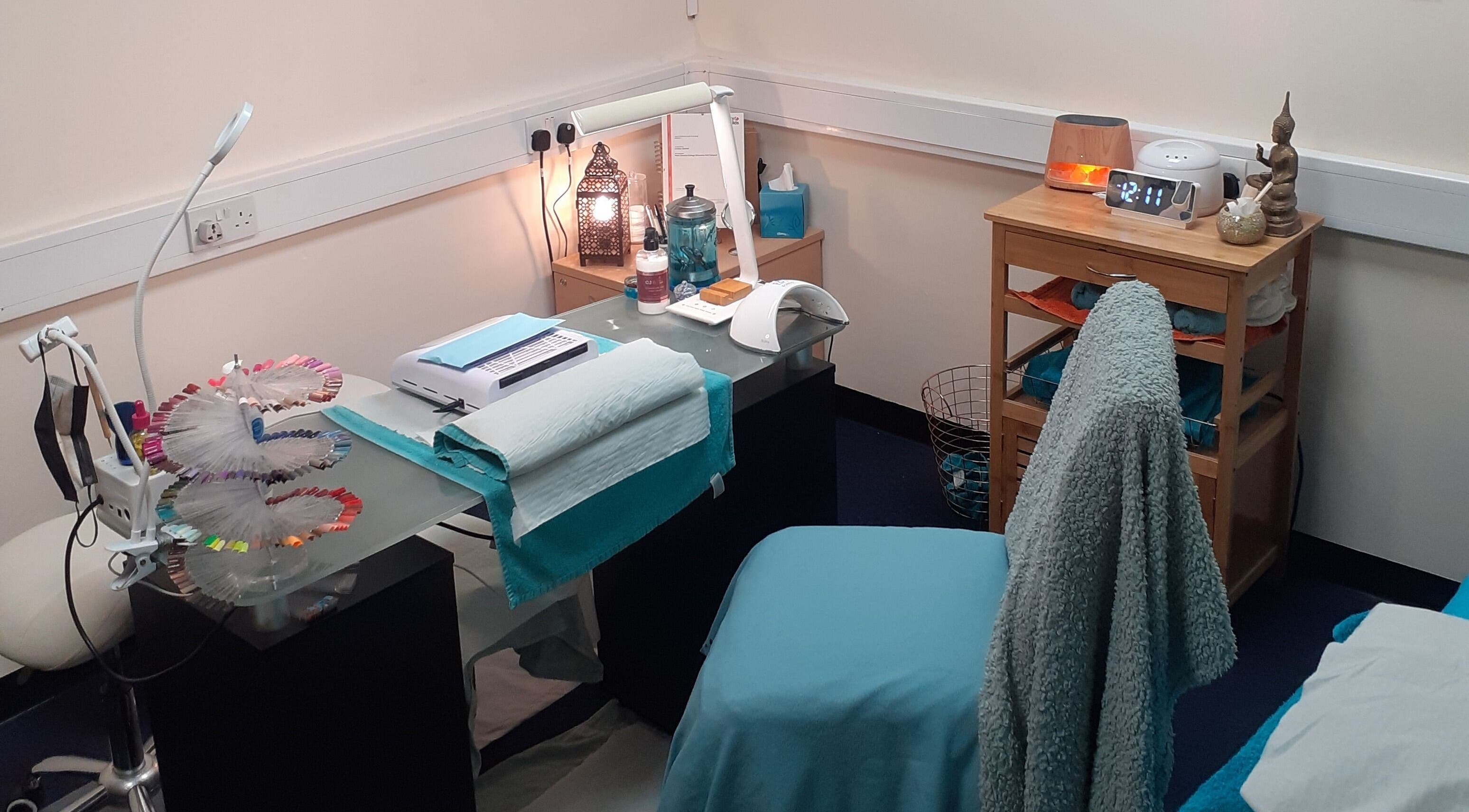 Elegant treatment room at The Nook, Ellesmere Port, England, GB, with soothing decor and beauty equipment.