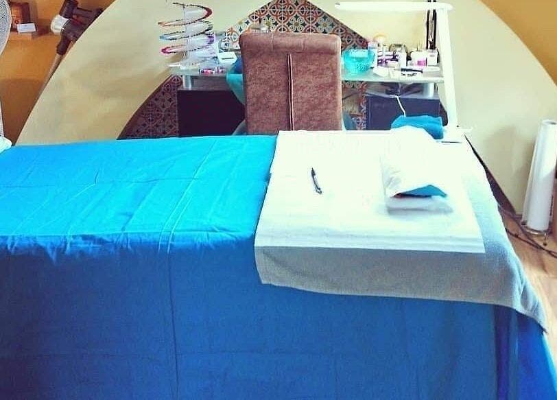 Cozy therapy room at The Nook in Ellesmere Port, England, GB with massage table and soothing colors.