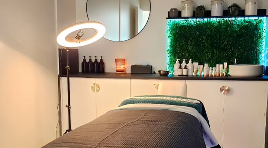 Tranquil spa room at Beauty by Manola in Bayview, Northern Territory, AU featuring a cozy treatment bed and lush decor.