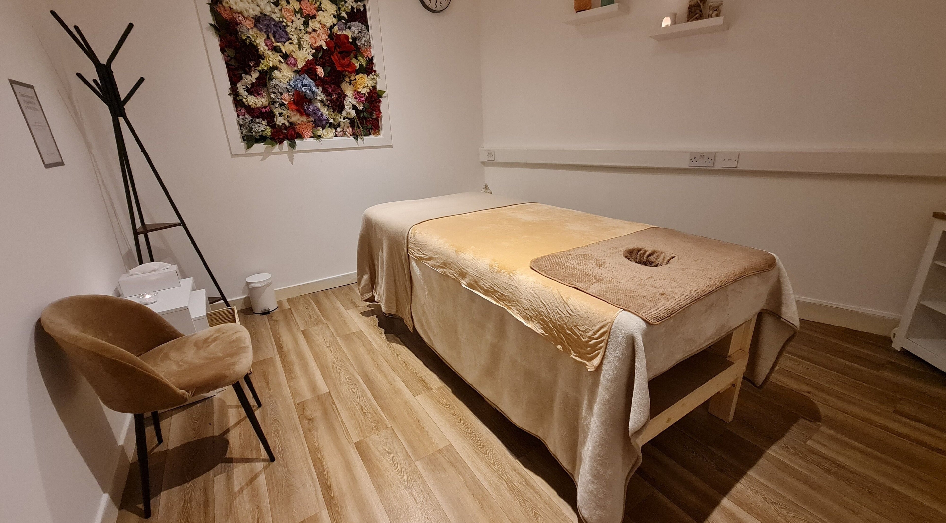 Tranquil massage room at Healing Point - Glasgow, Scotland, GB with cozy decor and calming ambiance.