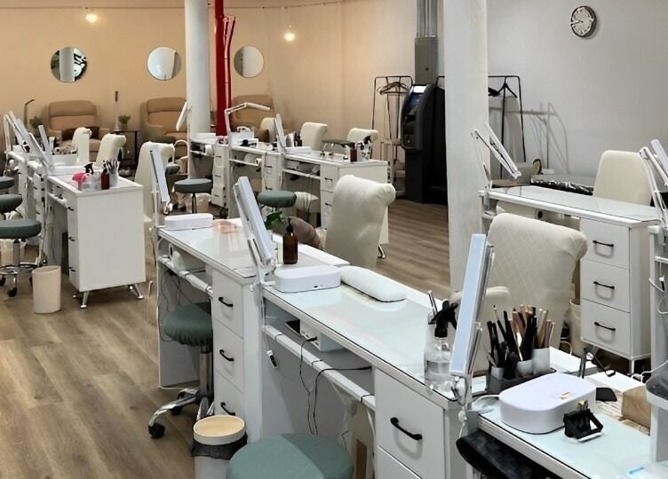 Spacious nail salon setup at M&M Studio NYC, New York, New York, US with polished workstations and chic decor.