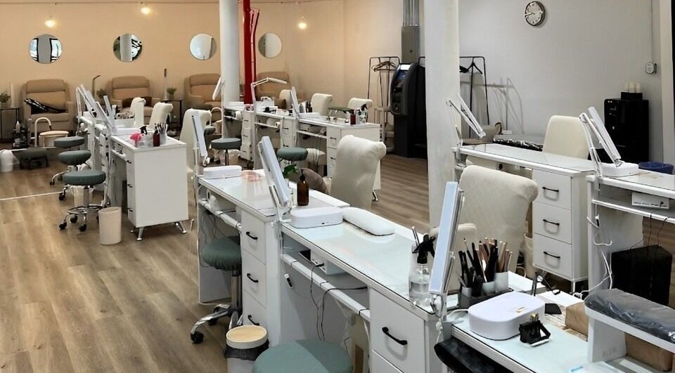 Spacious nail salon setup at M&M Studio NYC, New York, New York, US with polished workstations and chic decor.