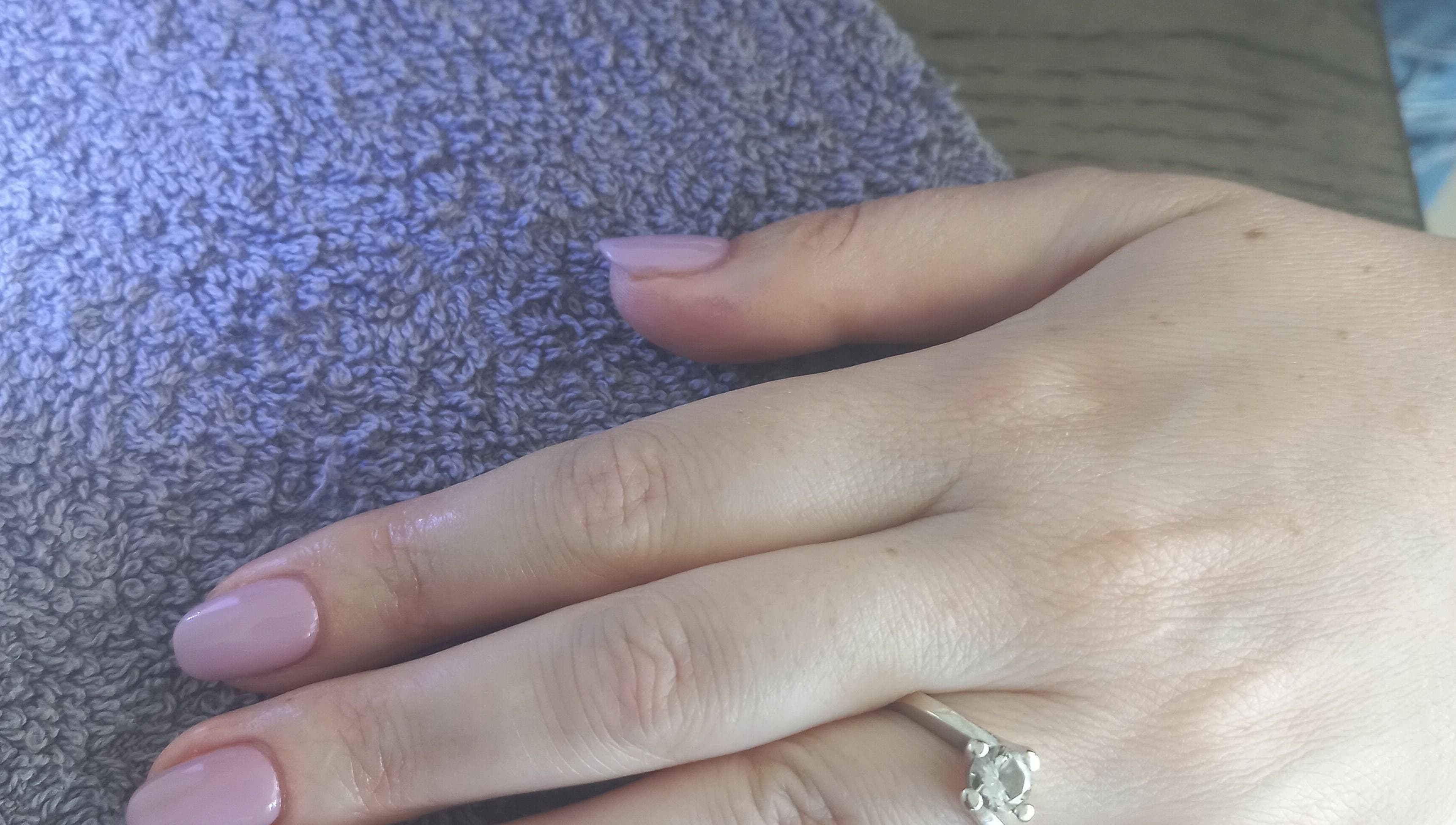 Elegant manicure with pale pink polish at Thobs and Cleo Beauty Bar, Johannesburg, Gauteng, ZA.