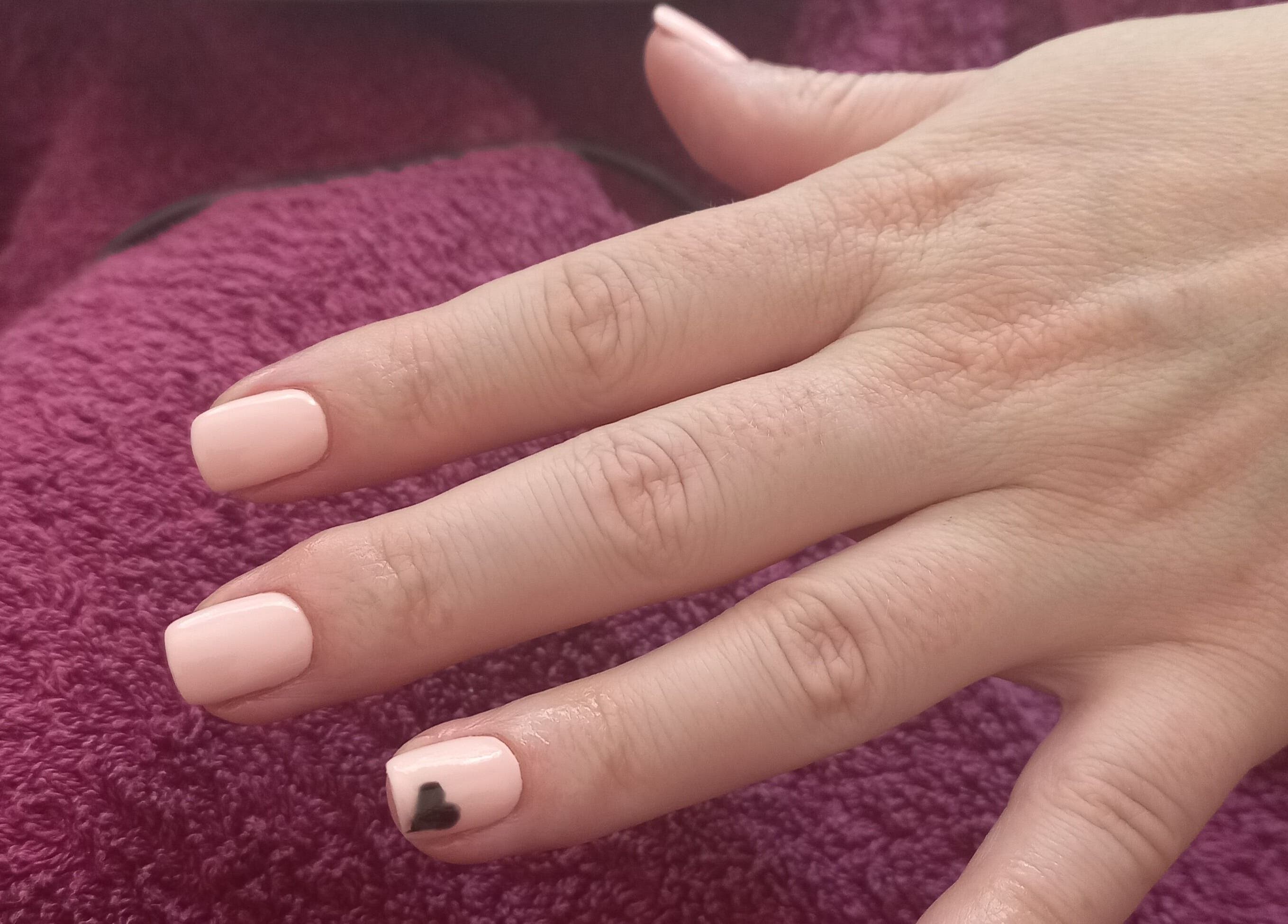 Manicure at Thobs and Cleo Beauty Bar, Johannesburg, Gauteng, ZA. Soft pink nails with black heart detail.