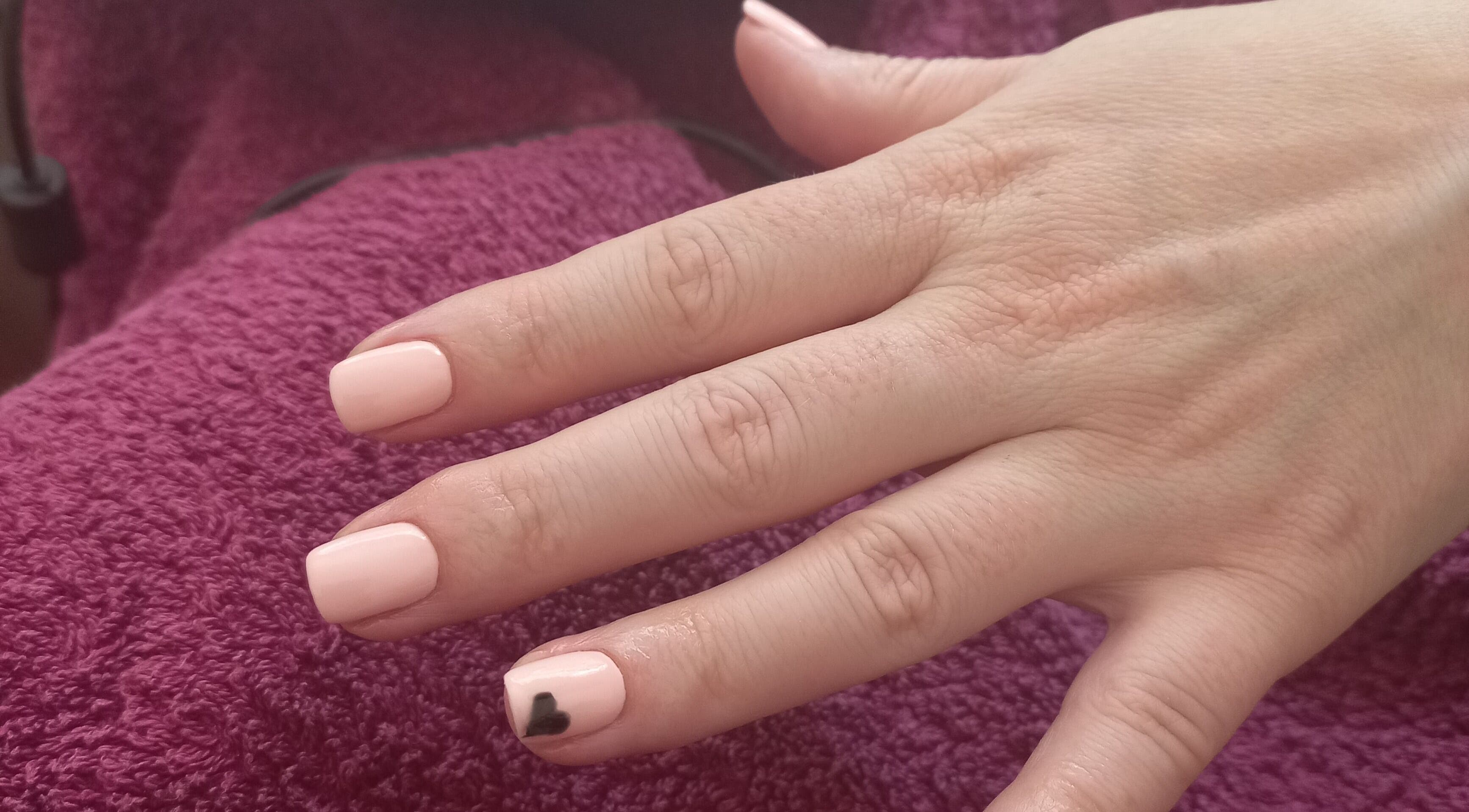 Manicure at Thobs and Cleo Beauty Bar, Johannesburg, Gauteng, ZA. Soft pink nails with black heart detail.
