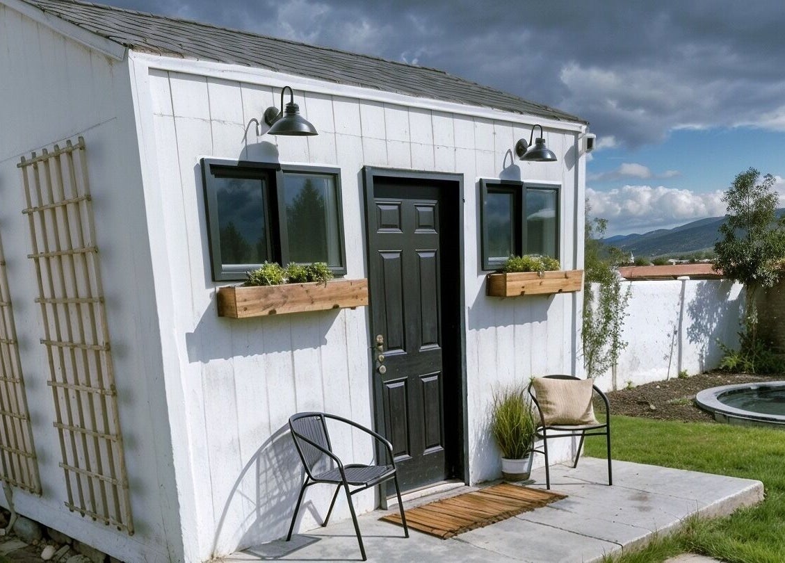Cozy outdoor view of Silk Electrolysis in Herriman, Utah, with chairs, small garden, and scenic backdrop.