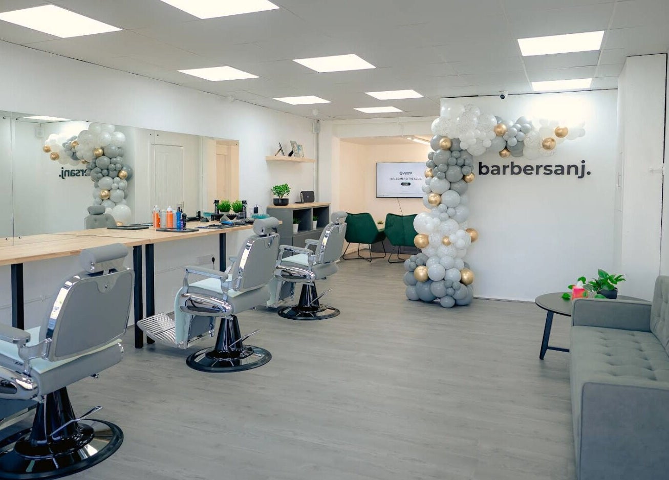 Modern interior of Barbersanj in Willenhall, England, featuring stylish chairs and decor for a premium grooming experience.