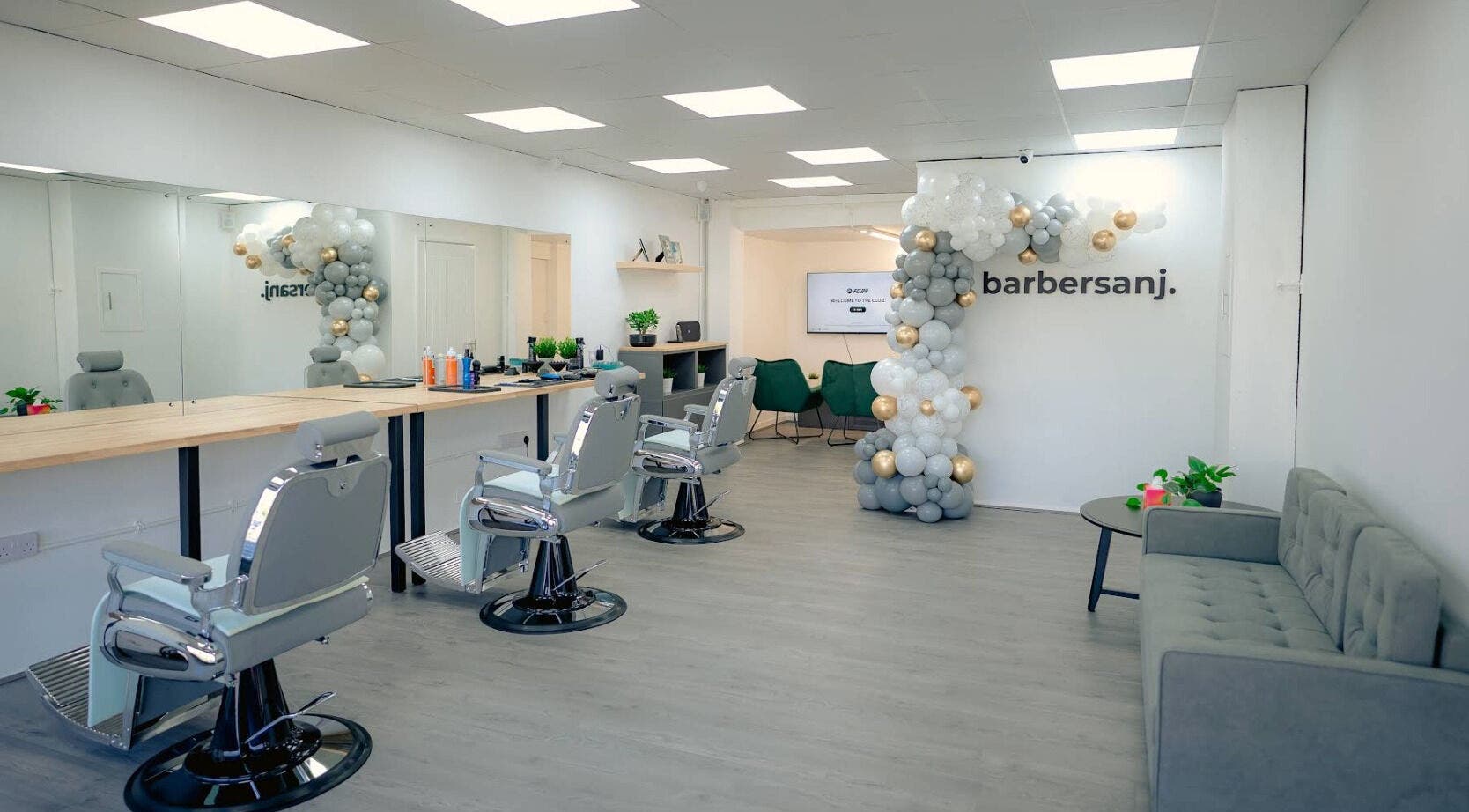 Modern interior of Barbersanj in Willenhall, England, featuring stylish chairs and decor for a premium grooming experience.