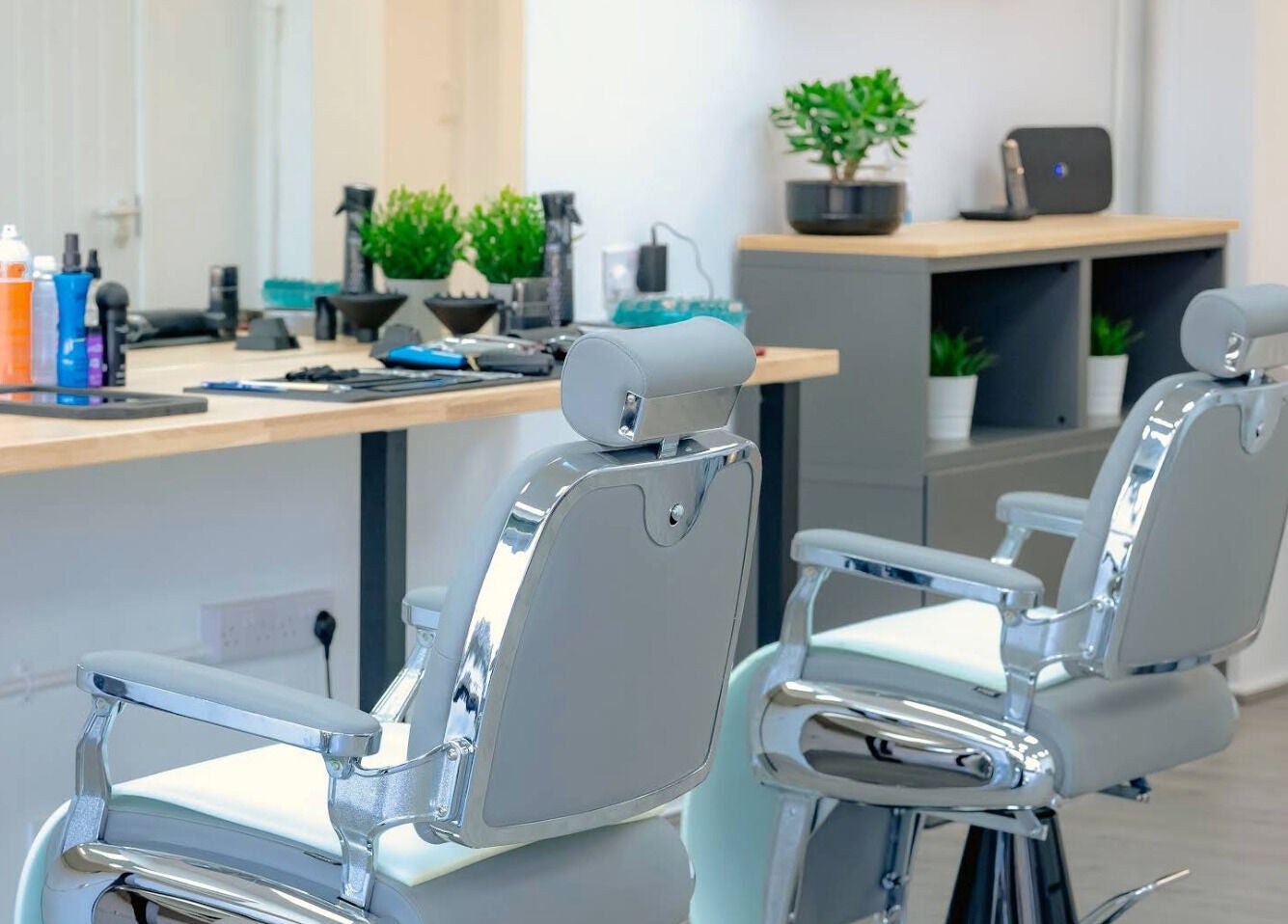 Modern barber chairs at Barbersanj in Willenhall, England, GB, offering a sleek and comfortable grooming experience.