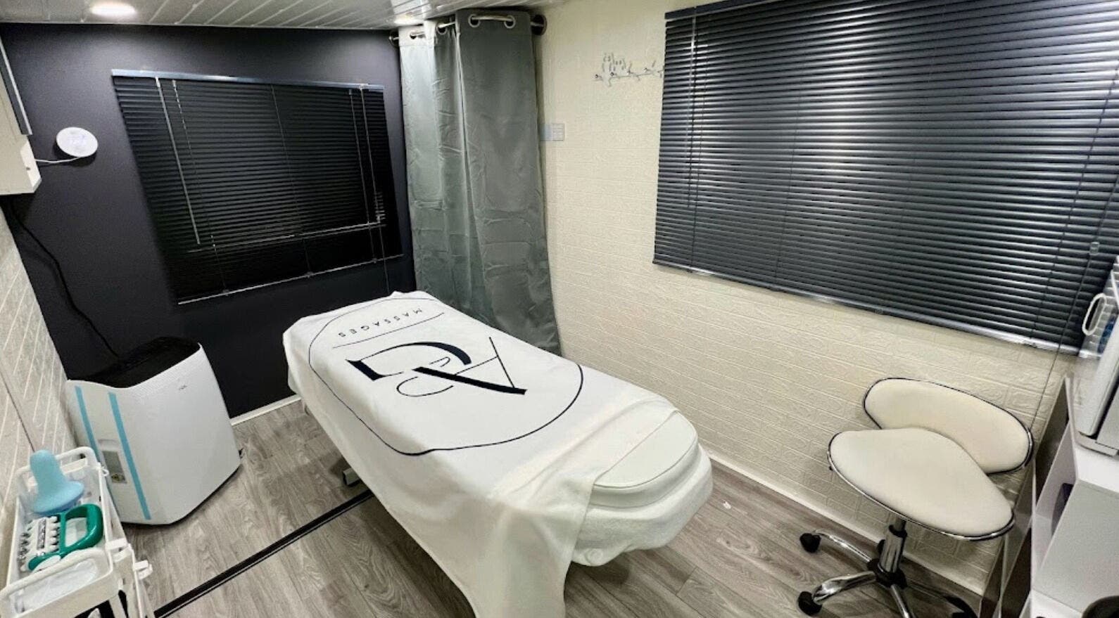 Tranquil massage room at AG Massages in Ash Vale, England, GB with massage table and modern decor.
