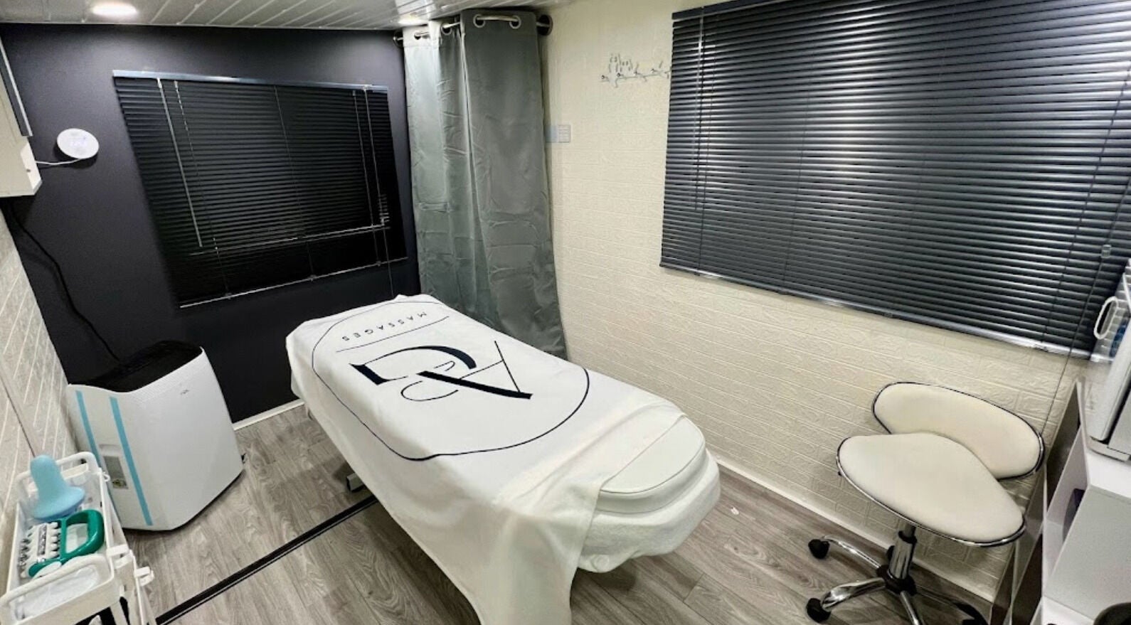 Tranquil massage room at AG Massages in Ash Vale, England, GB with massage table and modern decor.