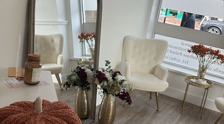 Luxurious seating area at ByLeah in Whitley Bay, England with elegant decor and floral arrangements.