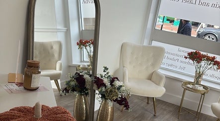 Elegant seating and decor at By Leah, Whitley Bay, England, GB. Modern, cozy beauty and wellness atmosphere.