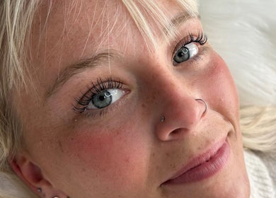 Close-up of a smiling woman showcasing her natural beauty at By Leah, Whitley Bay, England, GB.