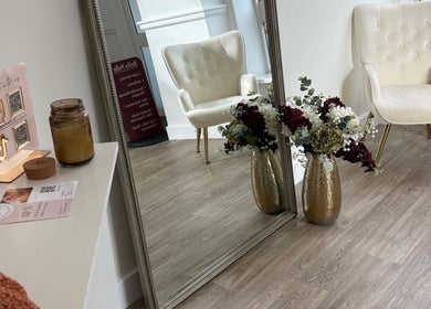 Luxurious seating and floral decor at By Leah, Whitley Bay, England, GB mirror reflection.