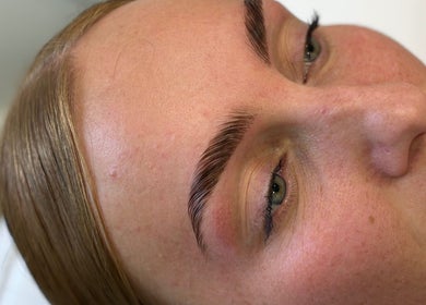 Perfectly shaped brows at By Leah in Whitley Bay, England, GB showcasing expert beauty treatment.