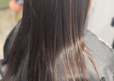 Lustrous long hair styled at Obsessed - Hair By Michelle, Rotorua, Bay Of Plenty, NZ, showcasing smooth textures.