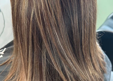 Close-up of a sleek, highlighted hairstyle at Obsessed - Hair By Michelle, Rotorua, Bay Of Plenty, NZ.