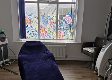 Treatment room with floral window at Wild Jasmine Retreat, Ramsbottom, England, GB.