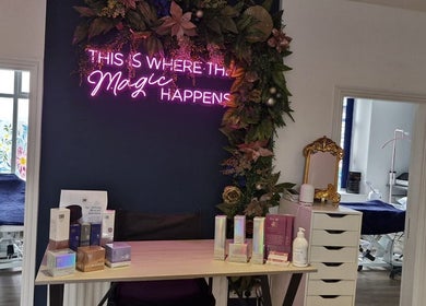 Chic reception at Wild Jasmine Retreat, Ramsbottom, England, GB with floral decor and neon sign.