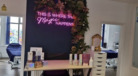 Chic reception at Wild Jasmine Retreat, Ramsbottom, England, GB with floral decor and neon sign.