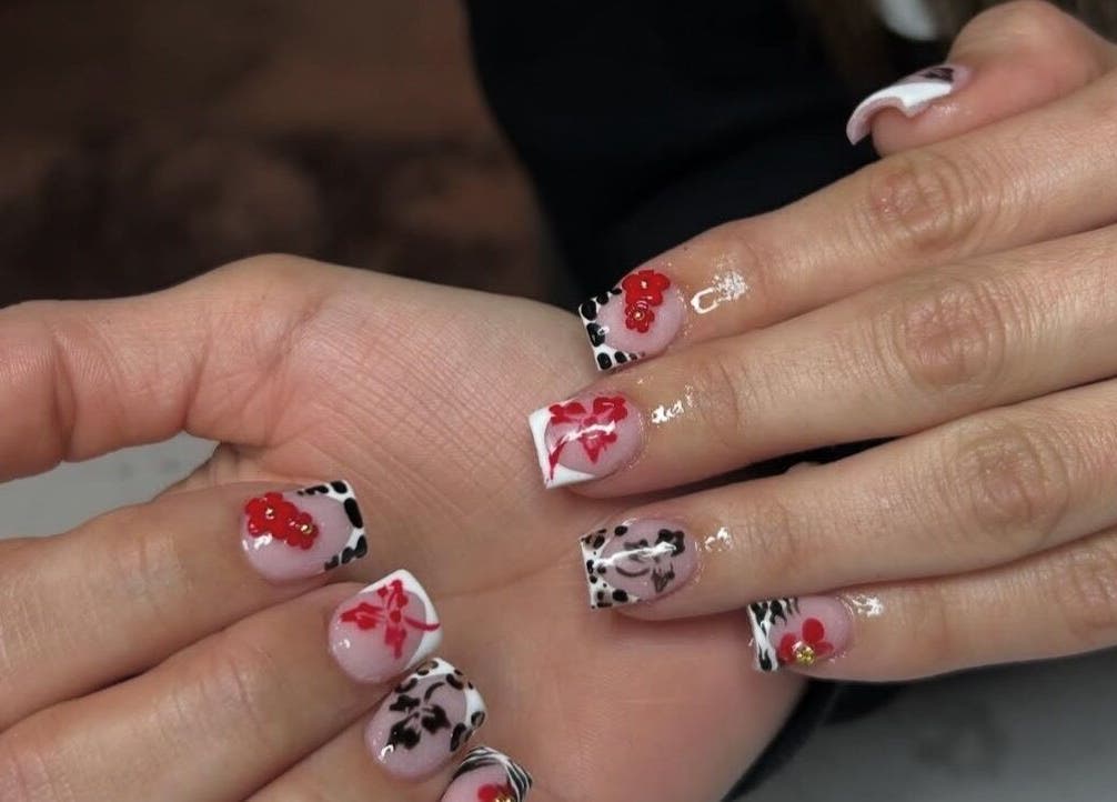 Artistic nail designs with red accents at Nails Byyp Imiya, Forney, Texas, US.